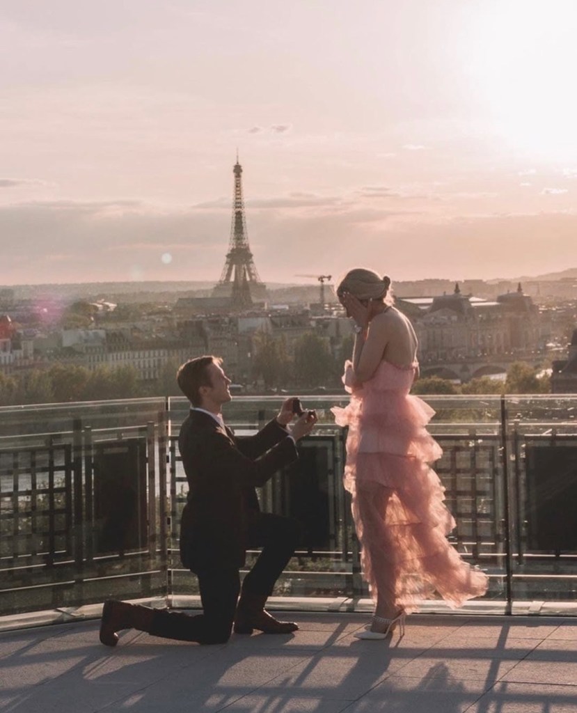 romantic proposal at Eiffel Tower in Paris with luxury engagement ring at sunset