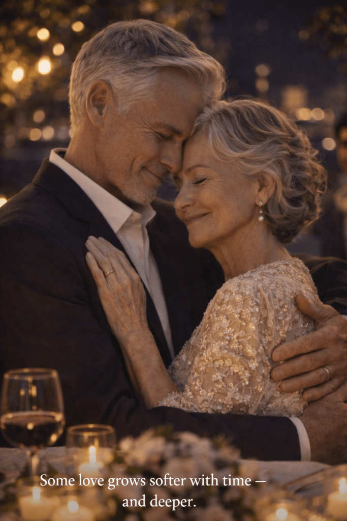 An elderly couple sharing a gentle embrace under warm evening lights, expressing love that has endured through a lifetime.